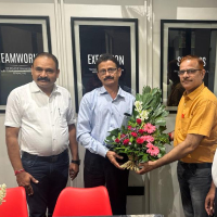 Subodh Kumar felicitating RK Shetty in Global Agro office.